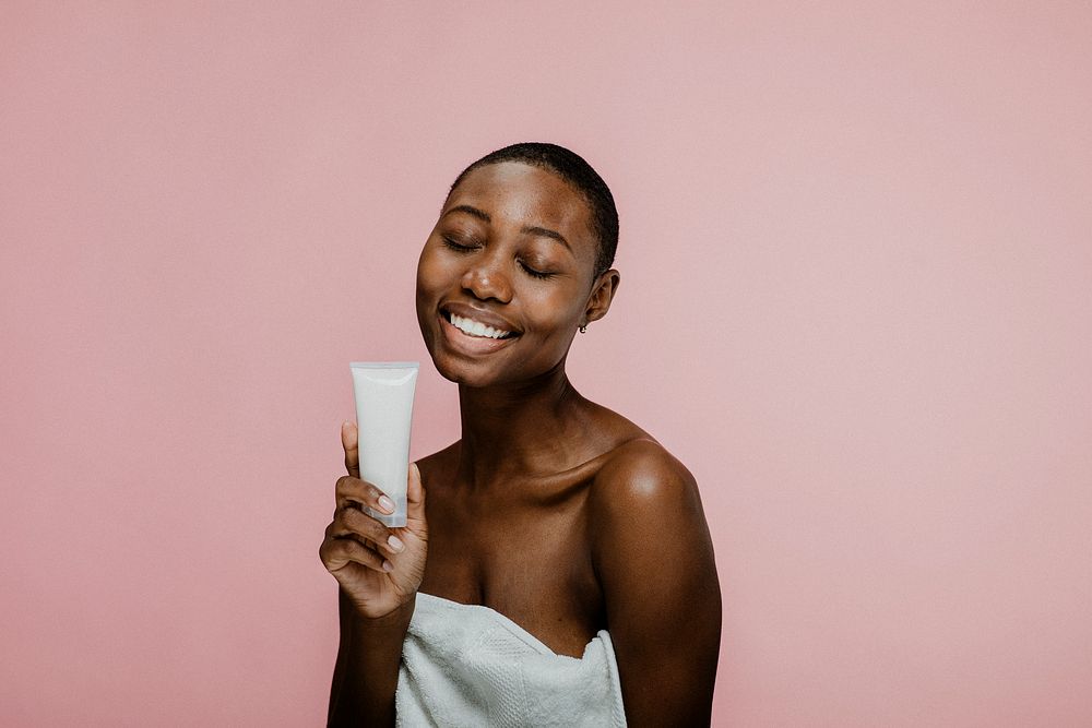 Happy black woman with a container mockup