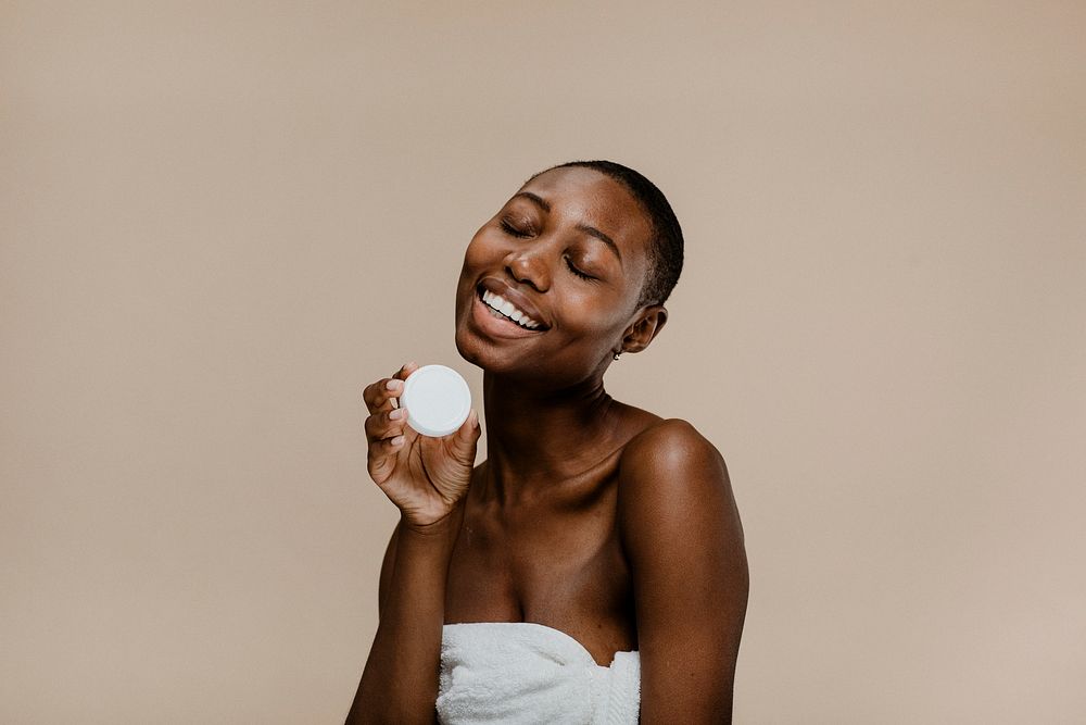 Happy black woman with a container mockup