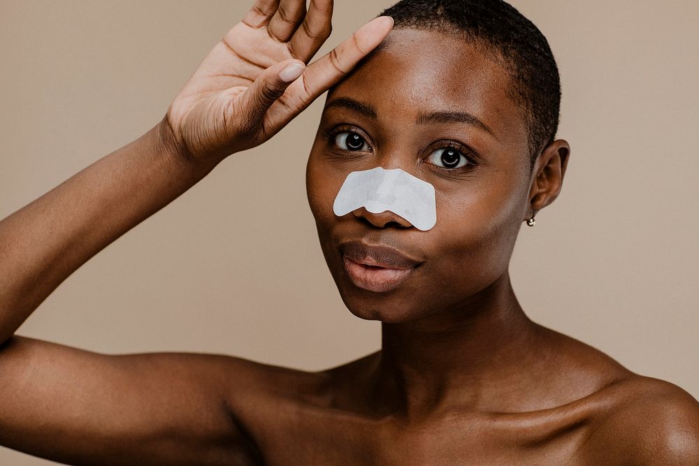 Black woman with a nose pore strip