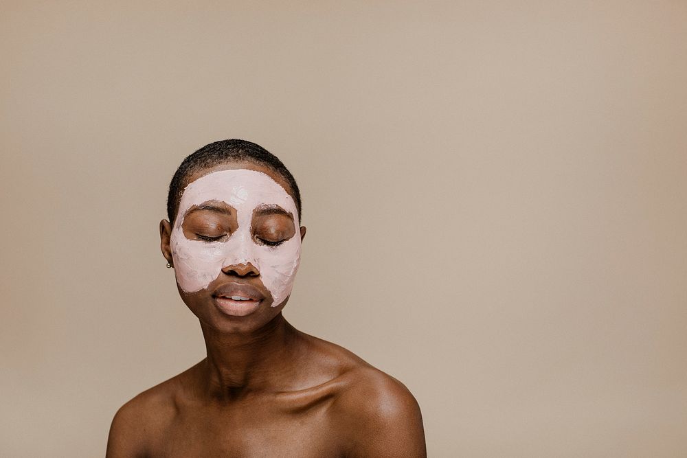 Black woman doing a face mask