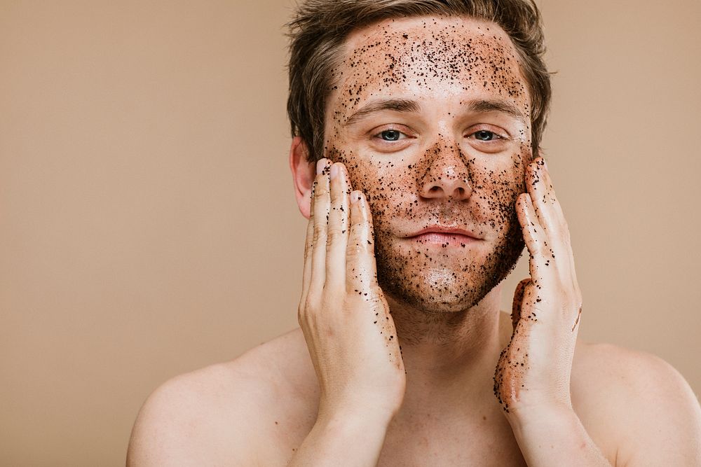 Man doing a face scrub