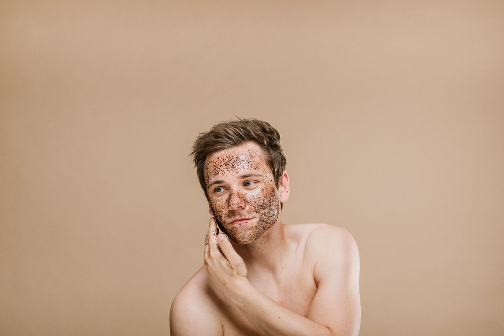 Man doing a face scrub