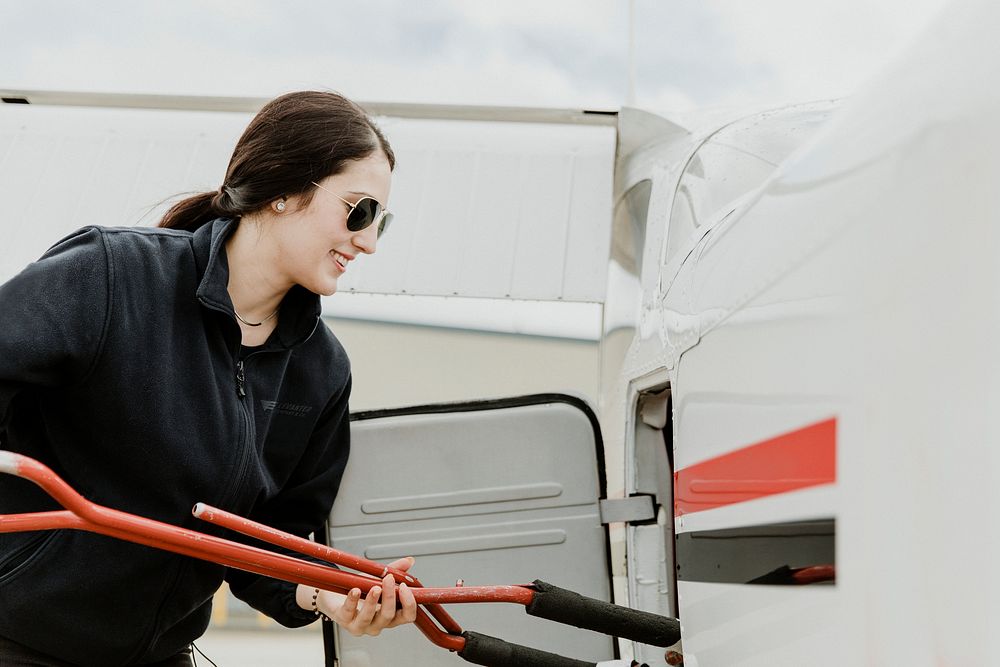 Airwoman holding a tow bar