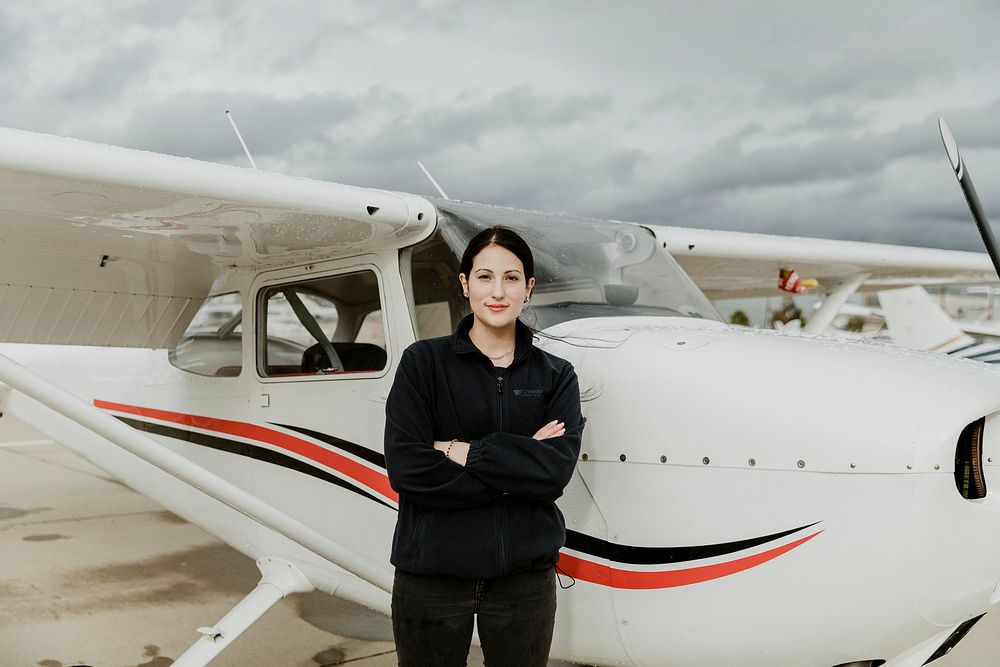 Aviator standing by the front propeller plane