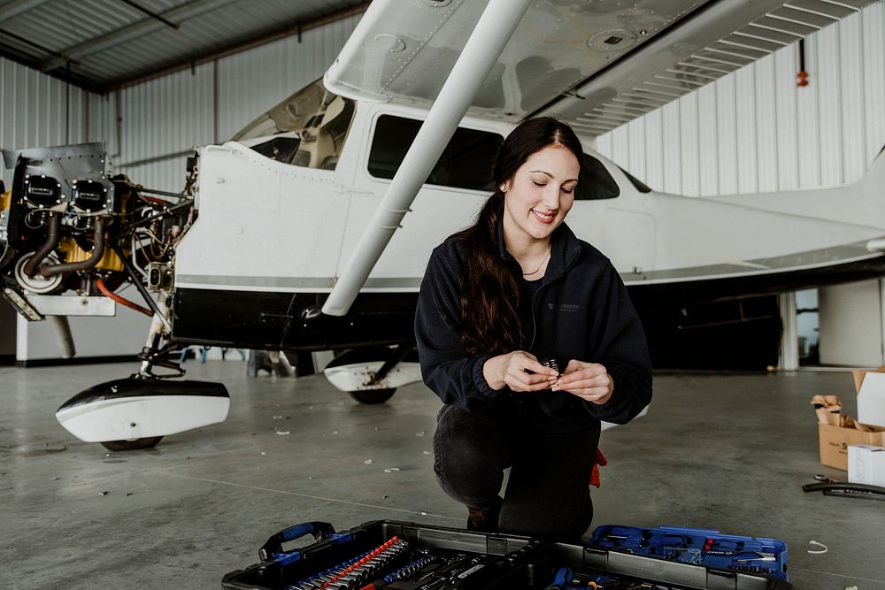 Female aviation technician with her tool box