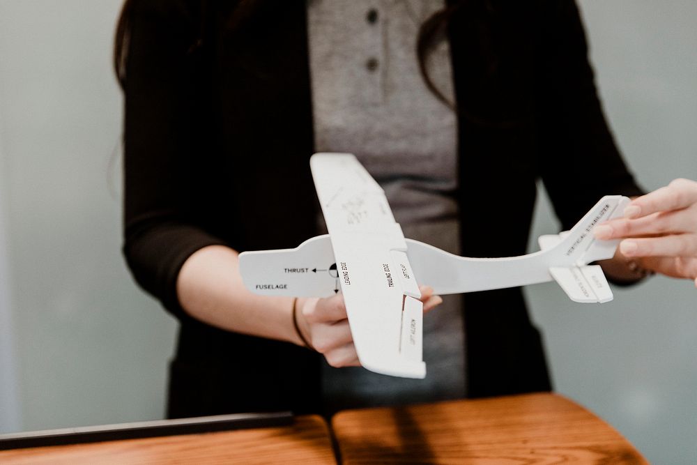 Woman explaining aerodynamics in a classroom
