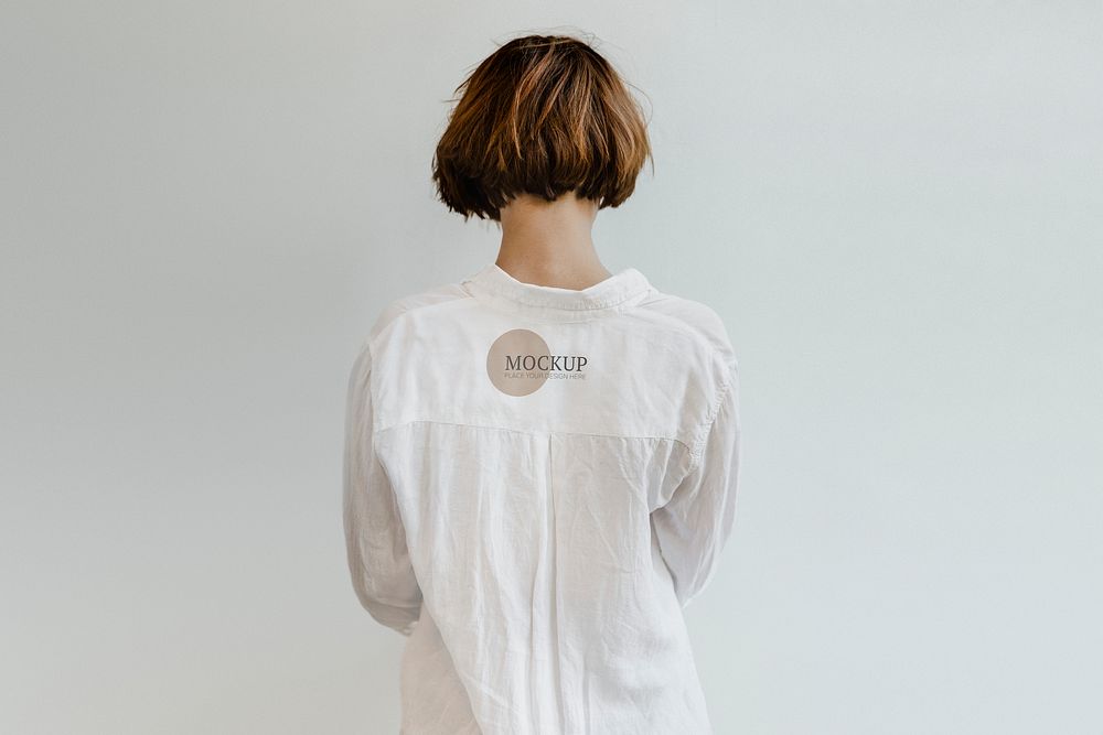 Rear view of a short dyed hair in a white shirt