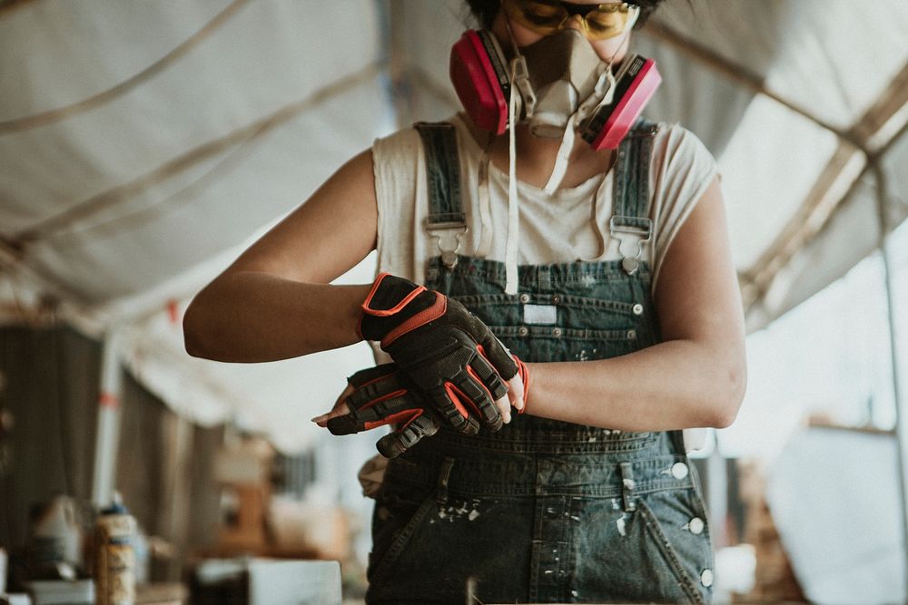 Female carpenter wearing personal protective equipment