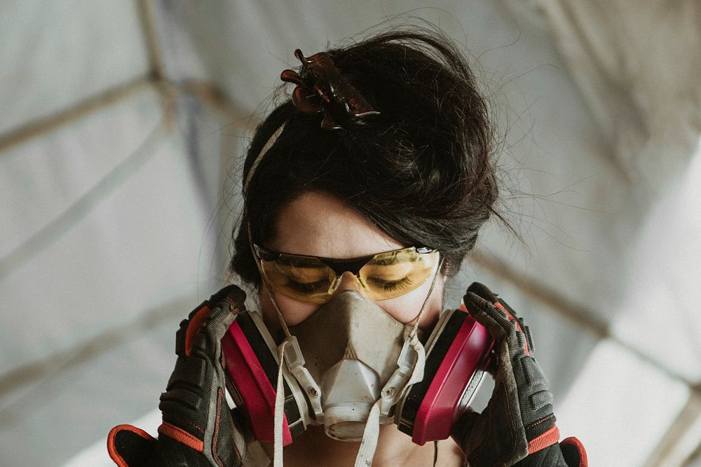 Female carpenter wearing personal protective equipment