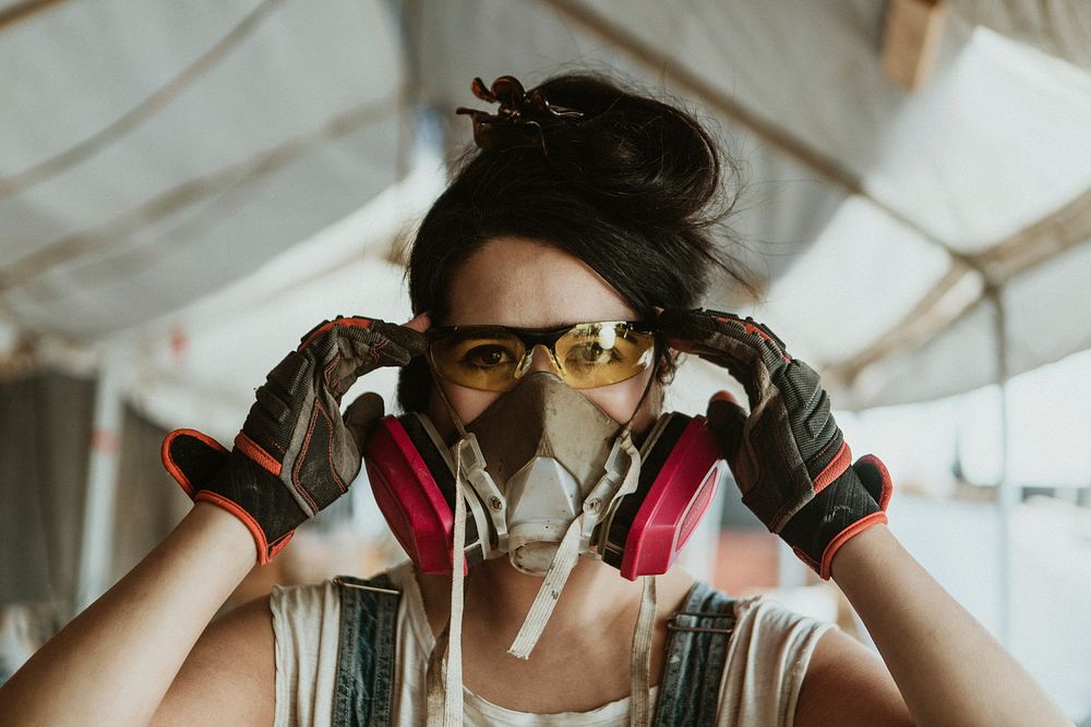 Female carpenter wearing personal protective equipment
