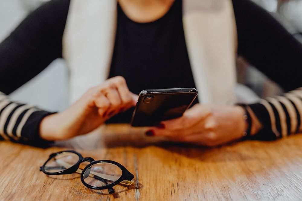 Woman playing on her cell phone