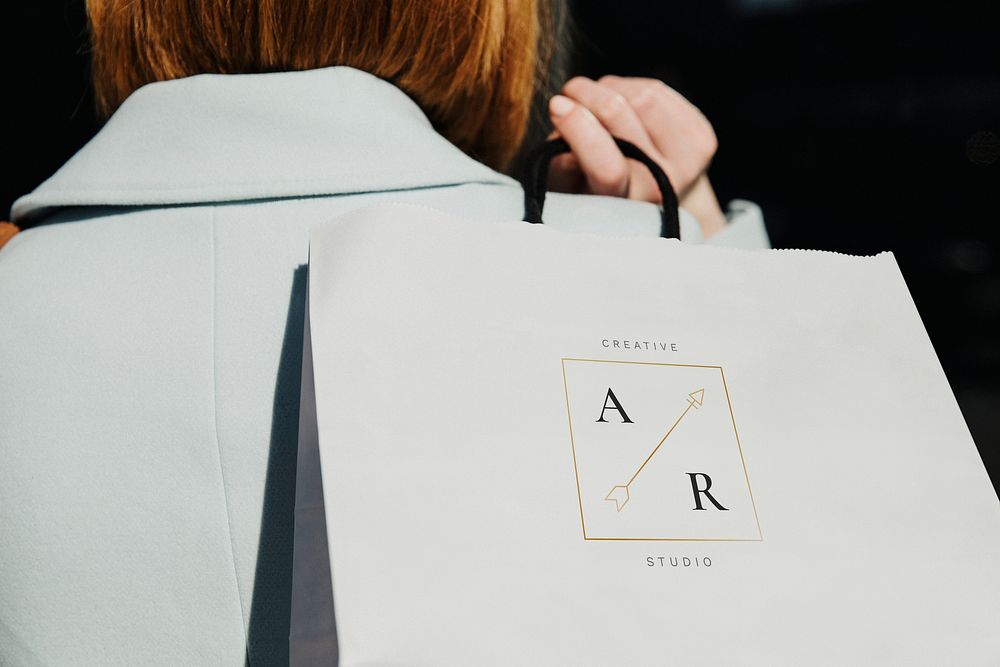 Woman with a shopping bag after a spending spree
