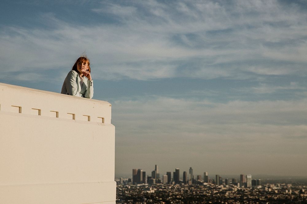 Woman enjoying the view of Los Angeles city from the Griffith Observatory, USA