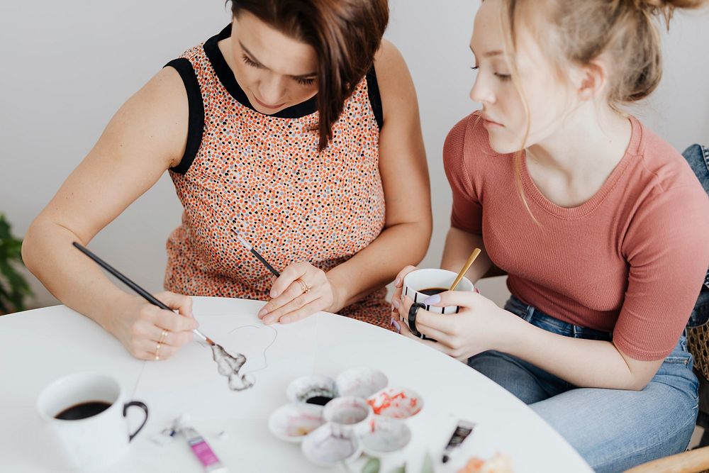 Mother and daughter making art together