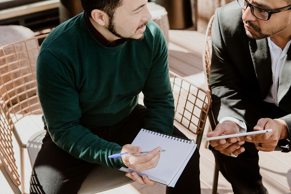 Business partners using  a tablet for discussion