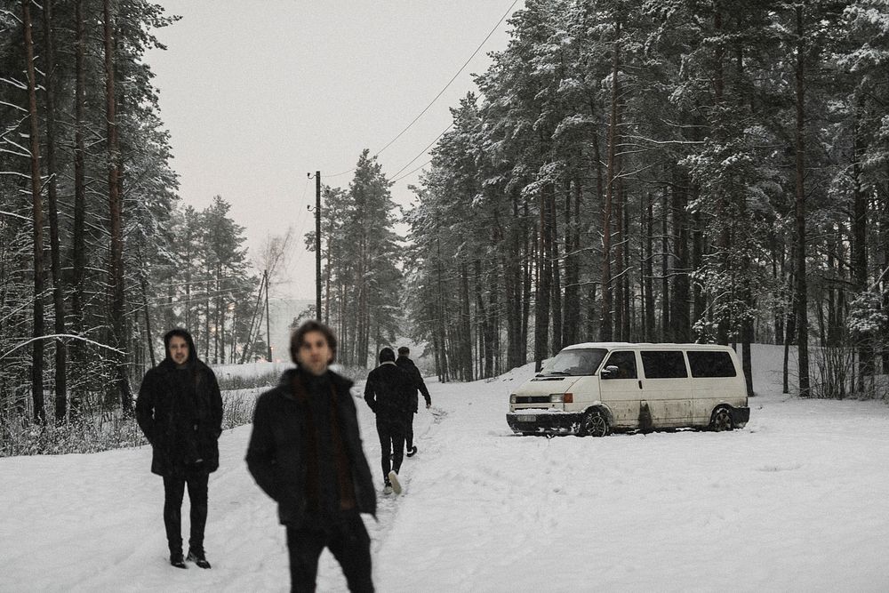 Friends walking in a snowy forest