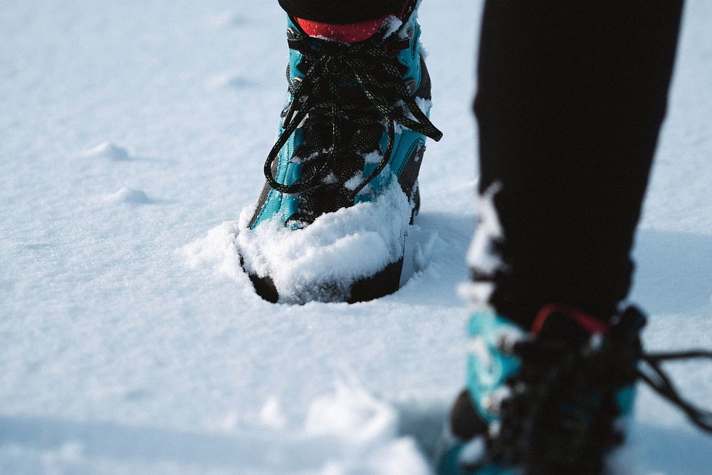 Woman trekking in her snow boots