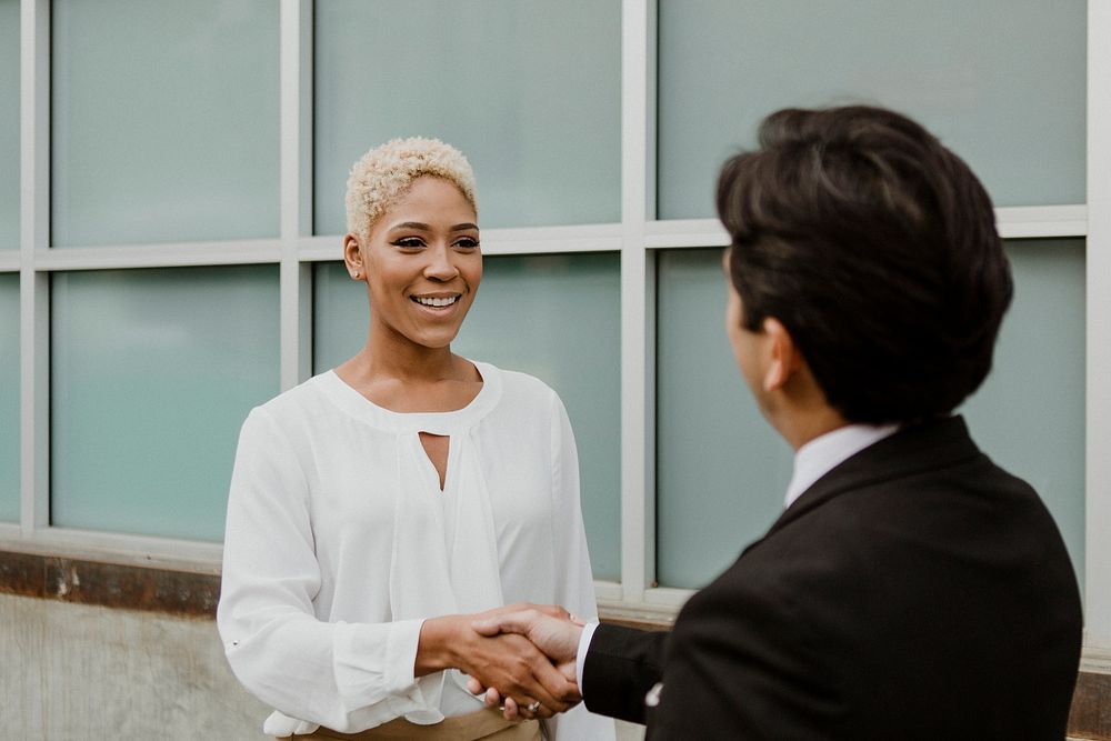 Businesspeople shaking hands for partnership