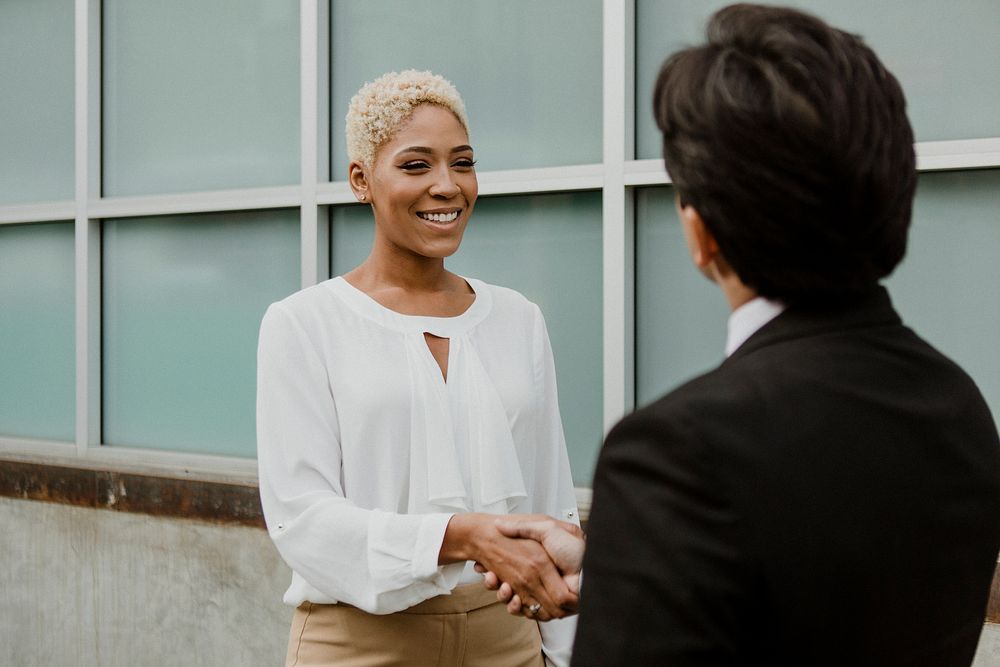 Businesspeople shaking hands for partnership