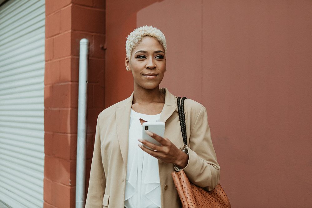 Black businesswoman using her cellphone