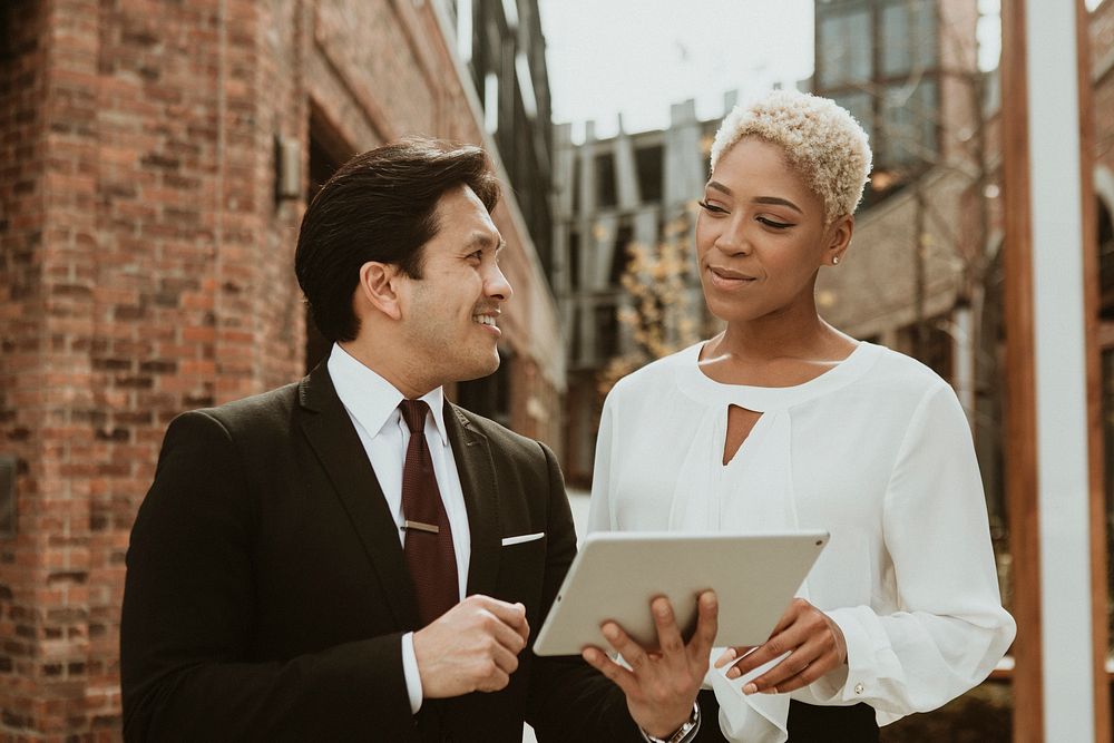 Businesspeople using a tablet in the city