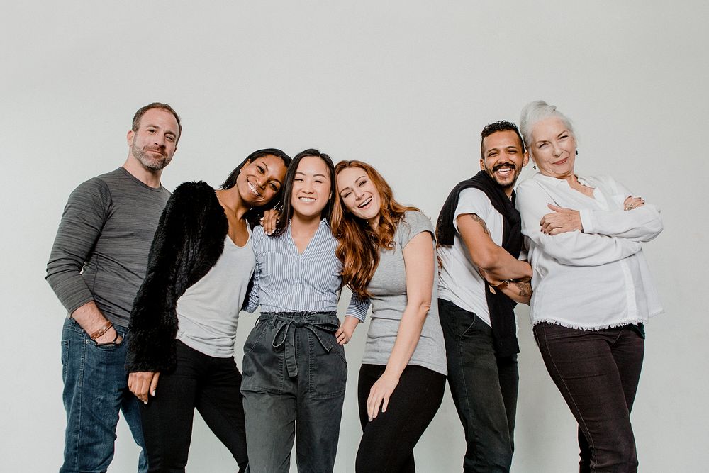 Group of cheerful diverse people in a white room