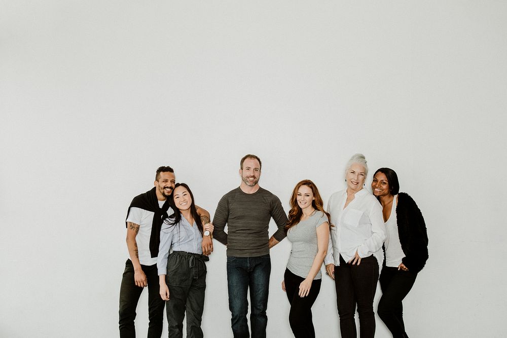 Group of cheerful diverse people in a white room