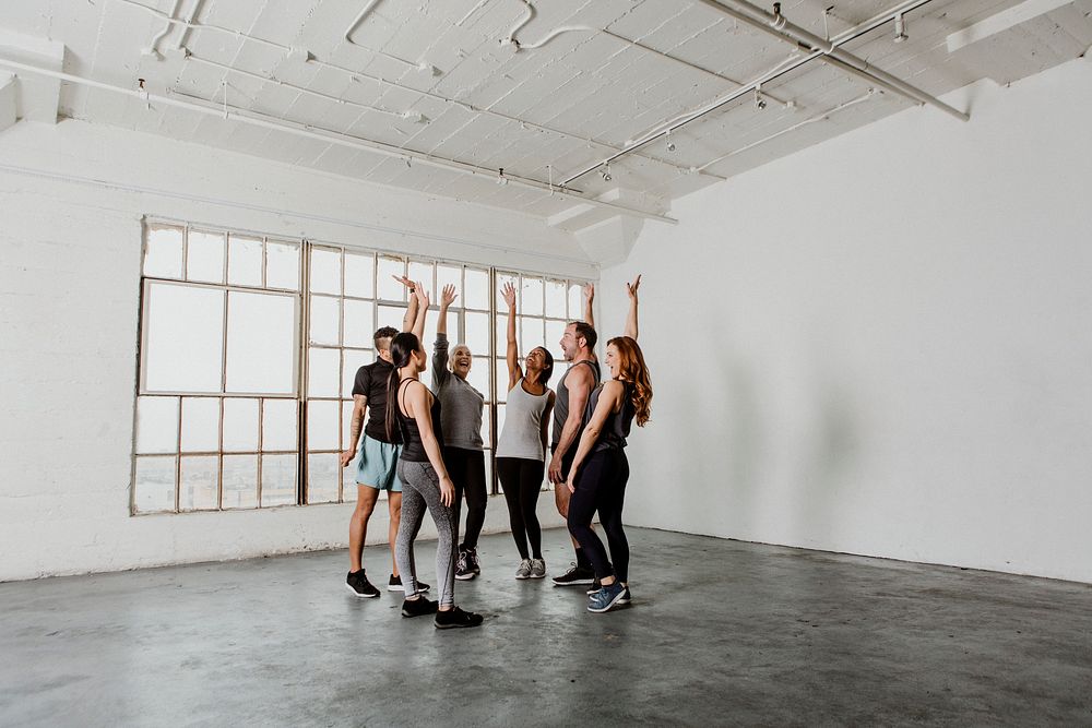 Healthy people grouping in a circle in a sport studio