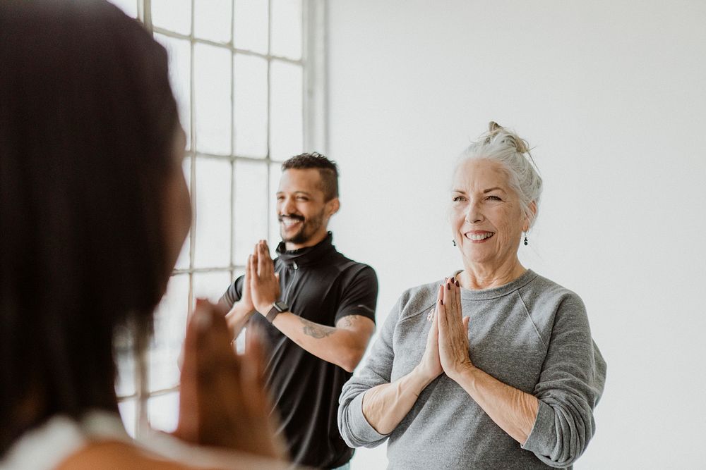 Diverse people in a Pranamasana pose