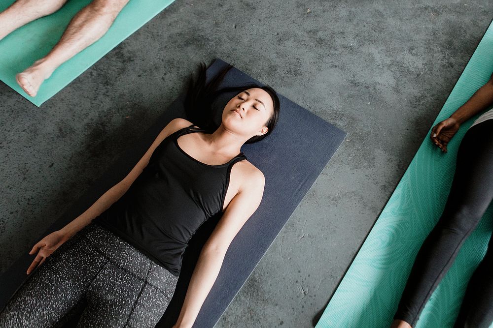 Diverse people in a Savasana pose