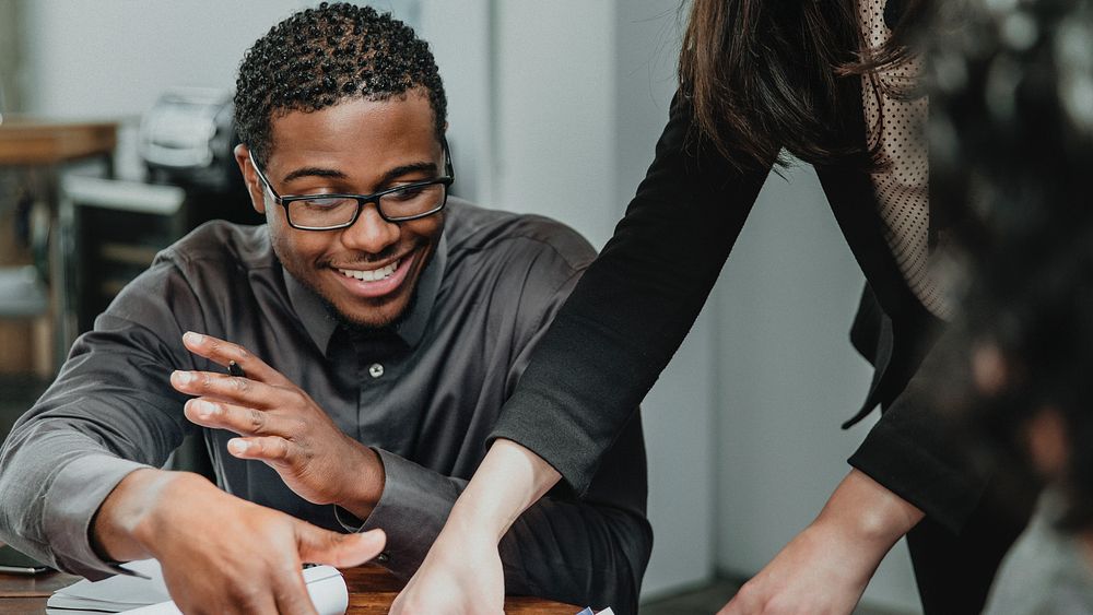 Happy businesspeople in a meeting room