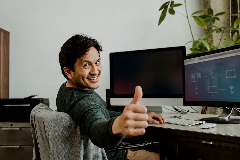 Happy businessman doing a thumbs up