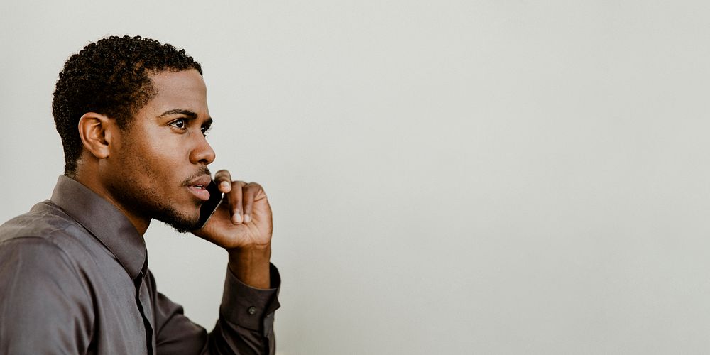 Black businessman talking on the phone