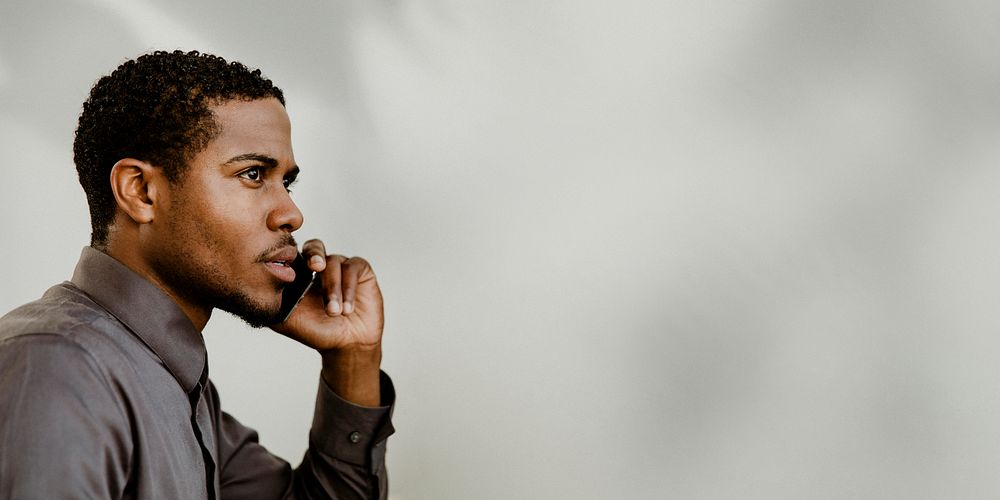 Black businessman talking on the phone