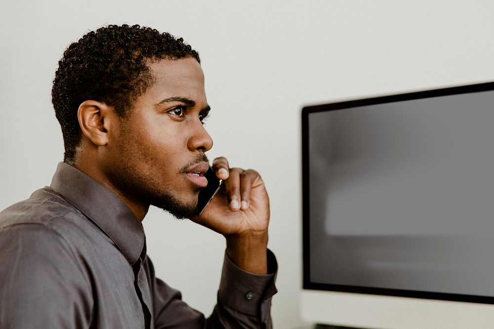 Black businessman talking on the phone