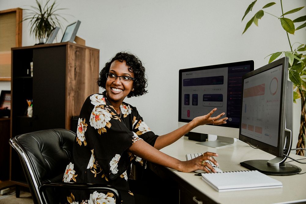 Happy black businesswoman working in the office