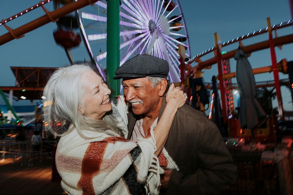 Cheerful elderly couple at Pacific Park in Santa Monica, California