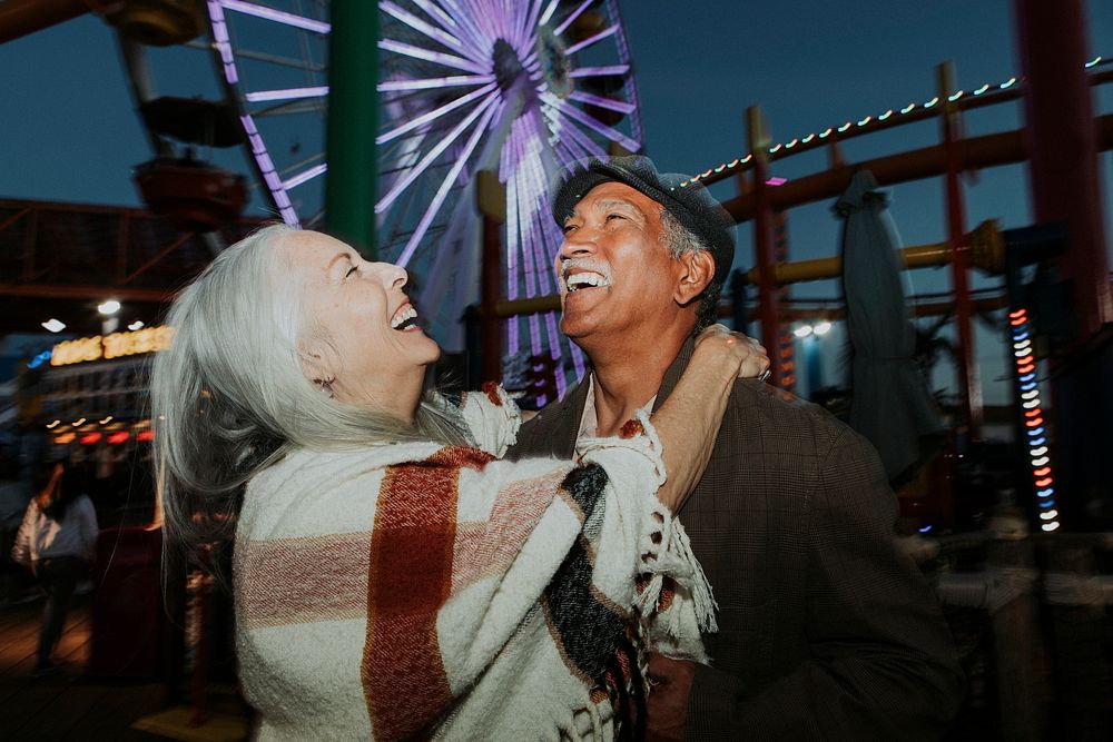 Cheerful elderly couple at Pacific Park in Santa Monica, California