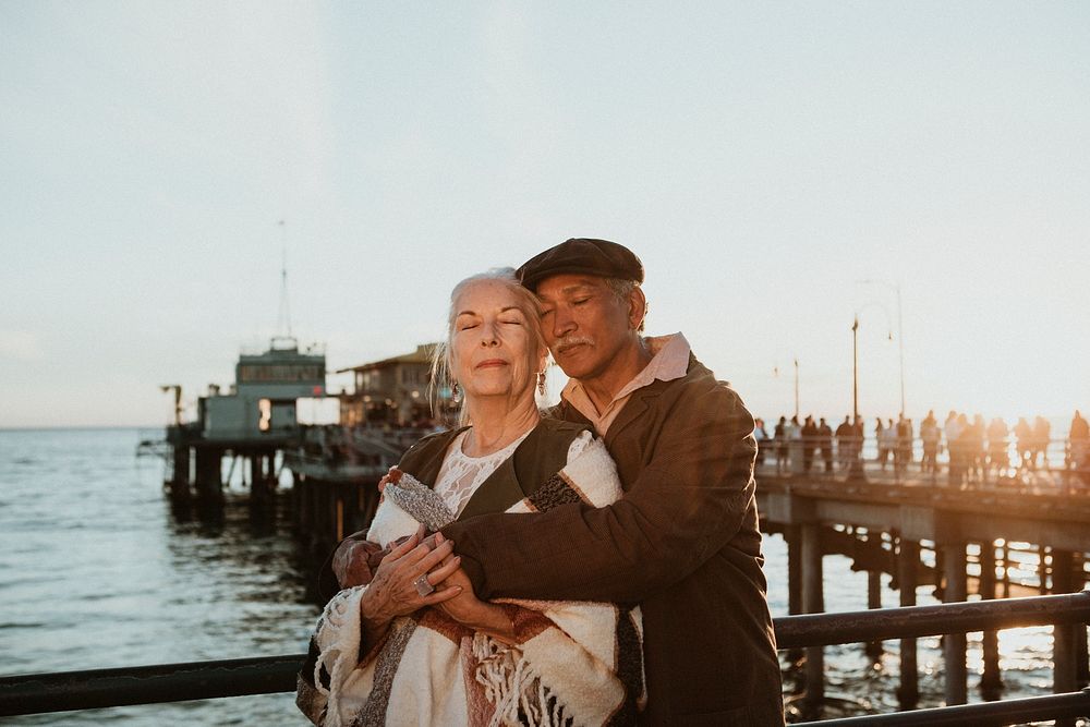 Romantic senior couple by the pier