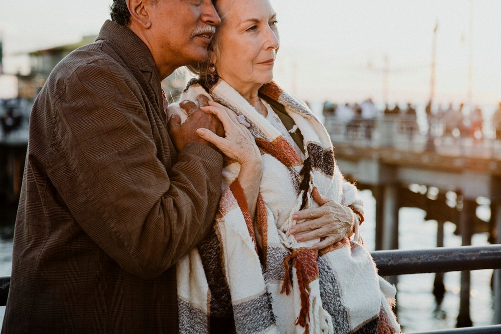 Romantic senior couple by the pier