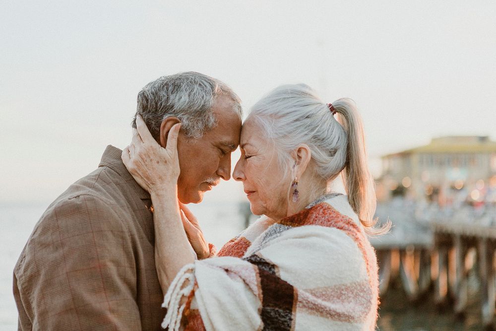 Romantic senior couple by the pier