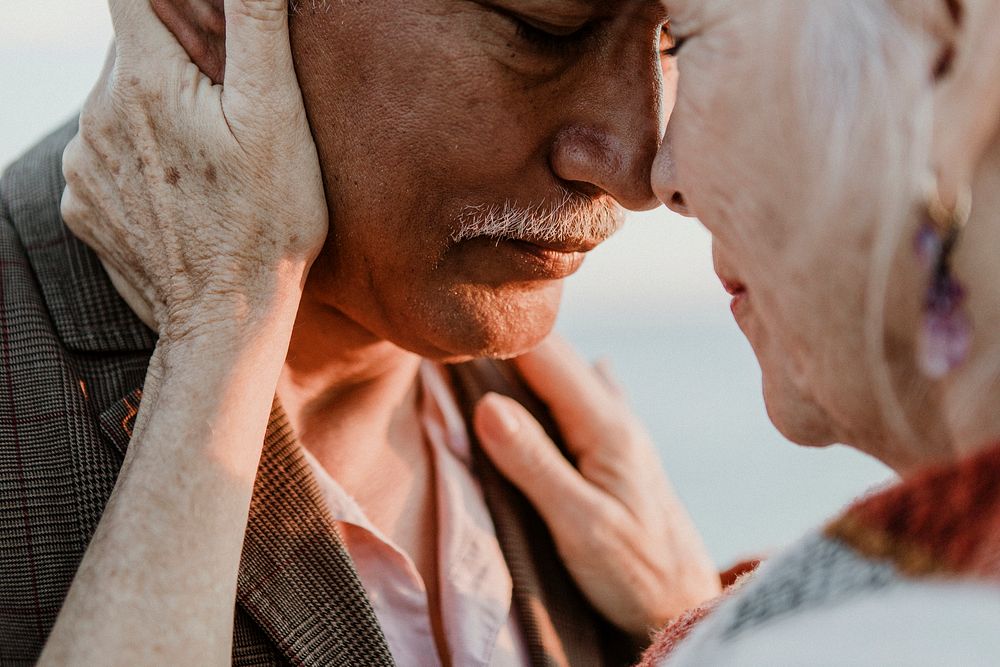 Romantic senior couple by the pier