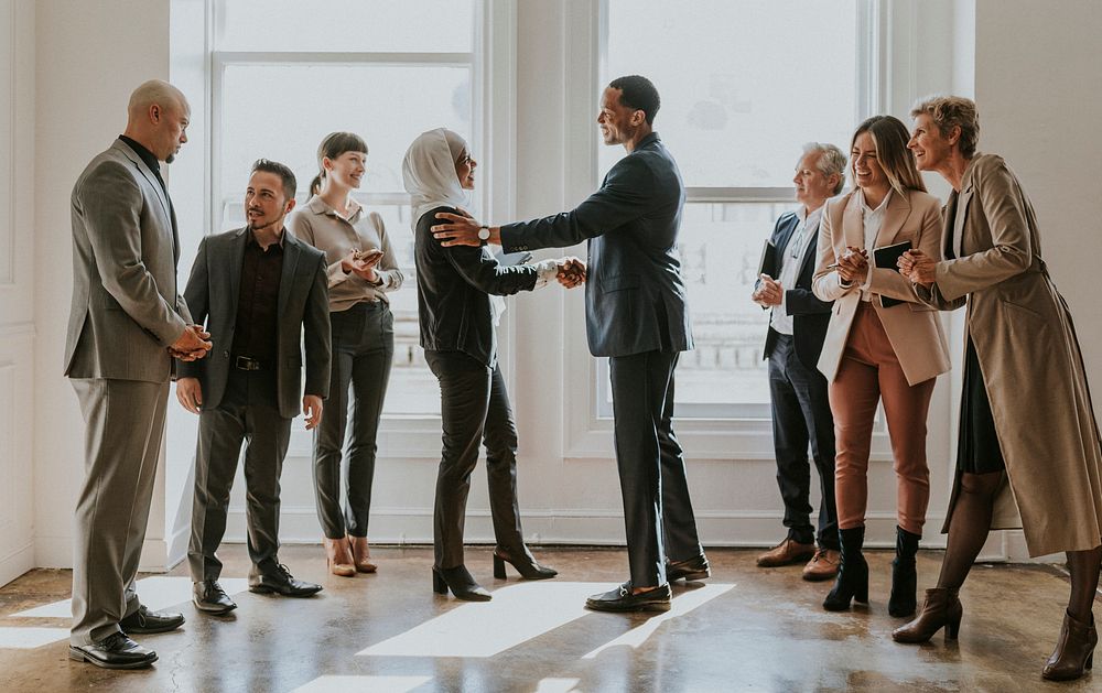 Happy diverse business people making a deal