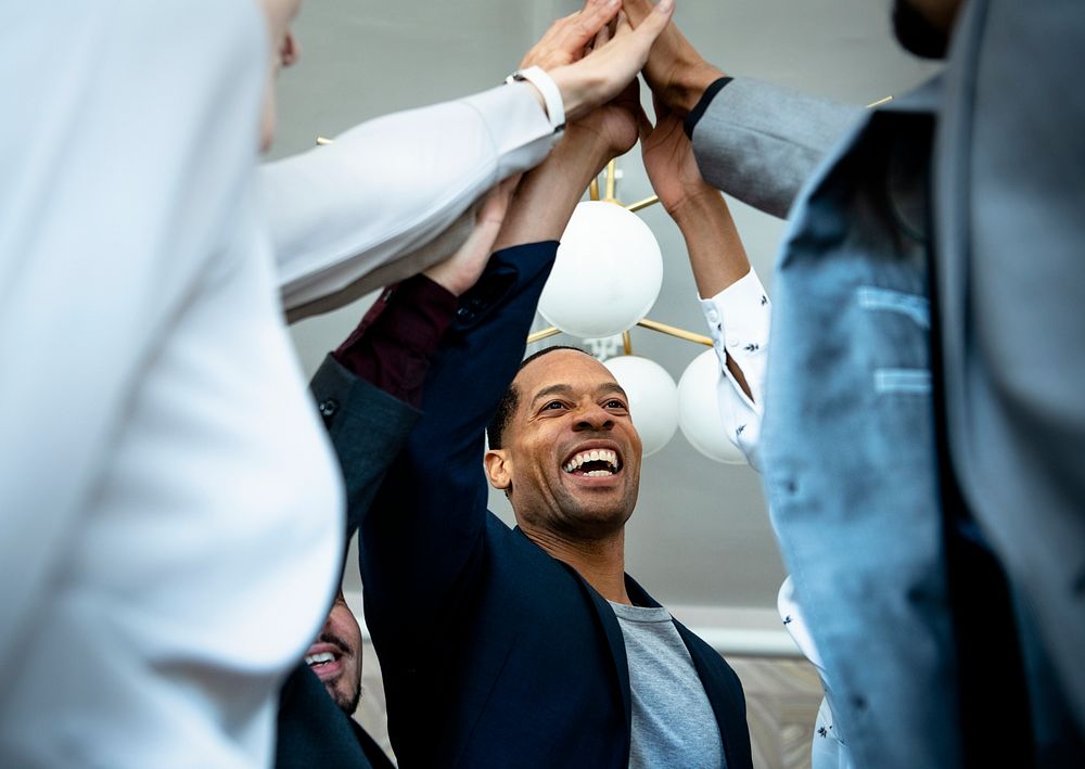 Cheerful business people doing a high five