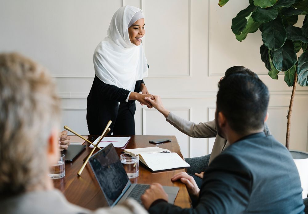 Happy diverse business people making a deal