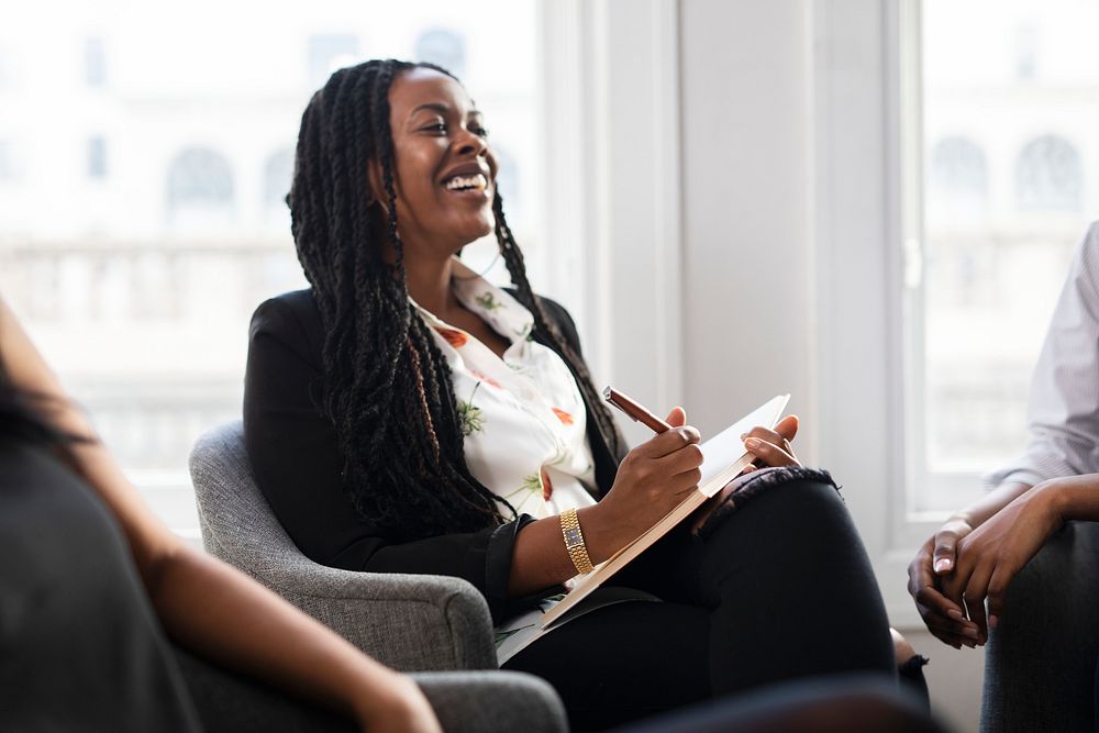 Happy black businesswoman in a meeting