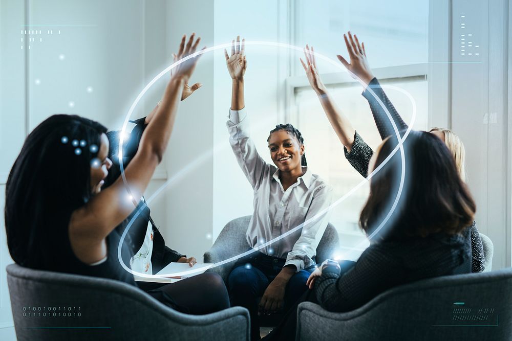 Businesswomen putting hands in the middle