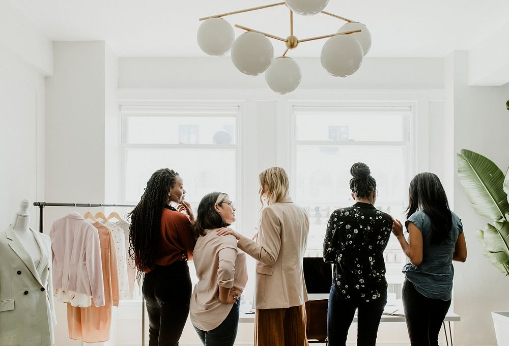 Happy female fashion designers working together