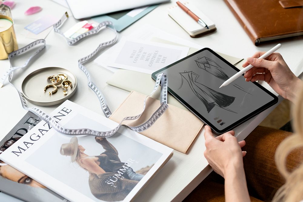 Fashion designer drawing on a digital tablet