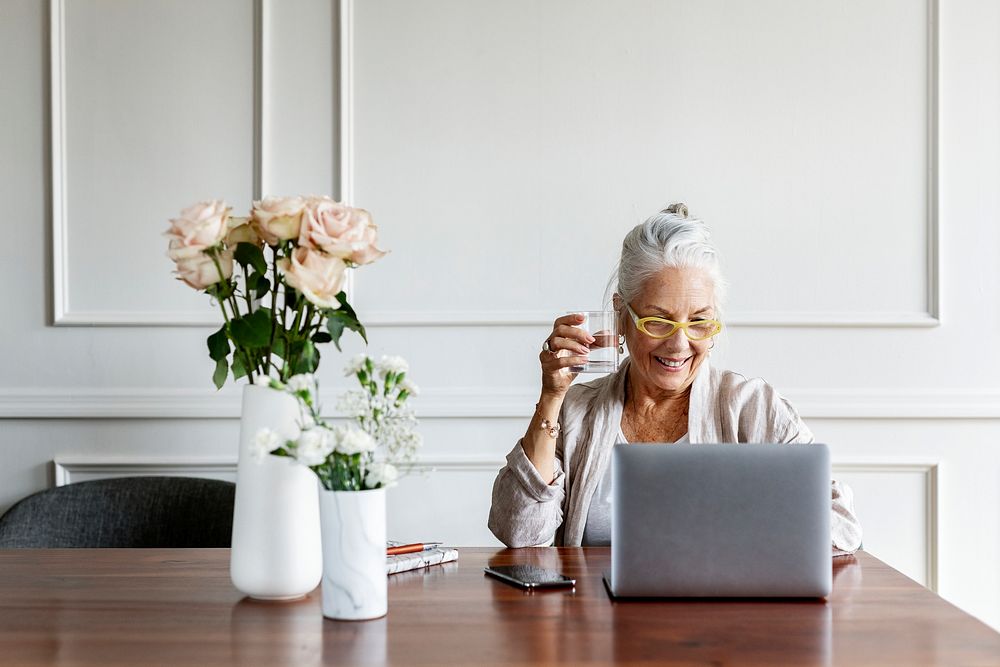 Empowering senior businesswoman using a laptop